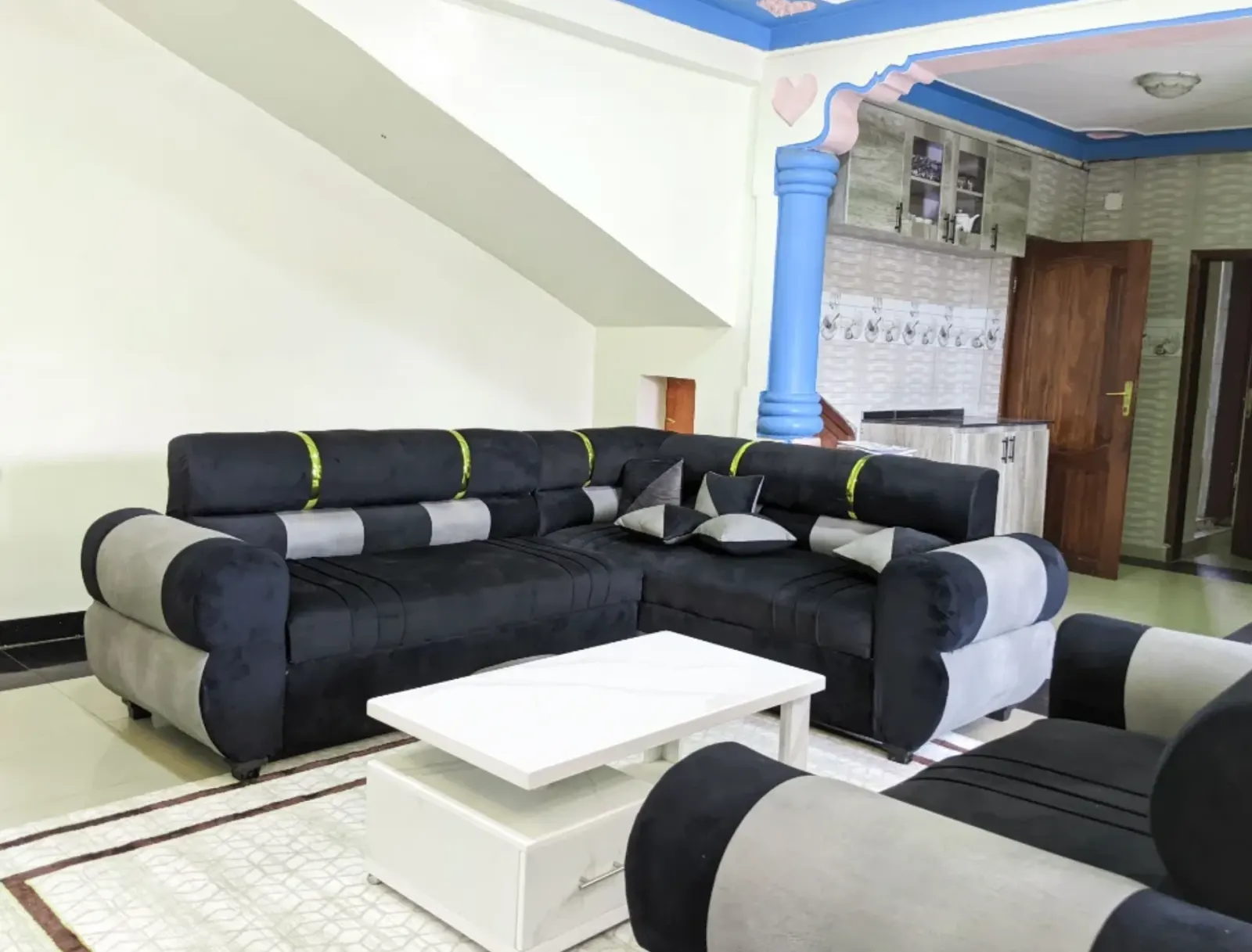 The living room, open to the kitchen